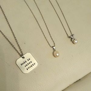 3 necklace lot: silver "hell" necklace, two pearl necklaces in silver